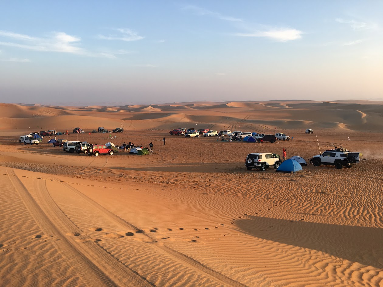 Dubai Offroaders members camp and tents in the desert at sunset